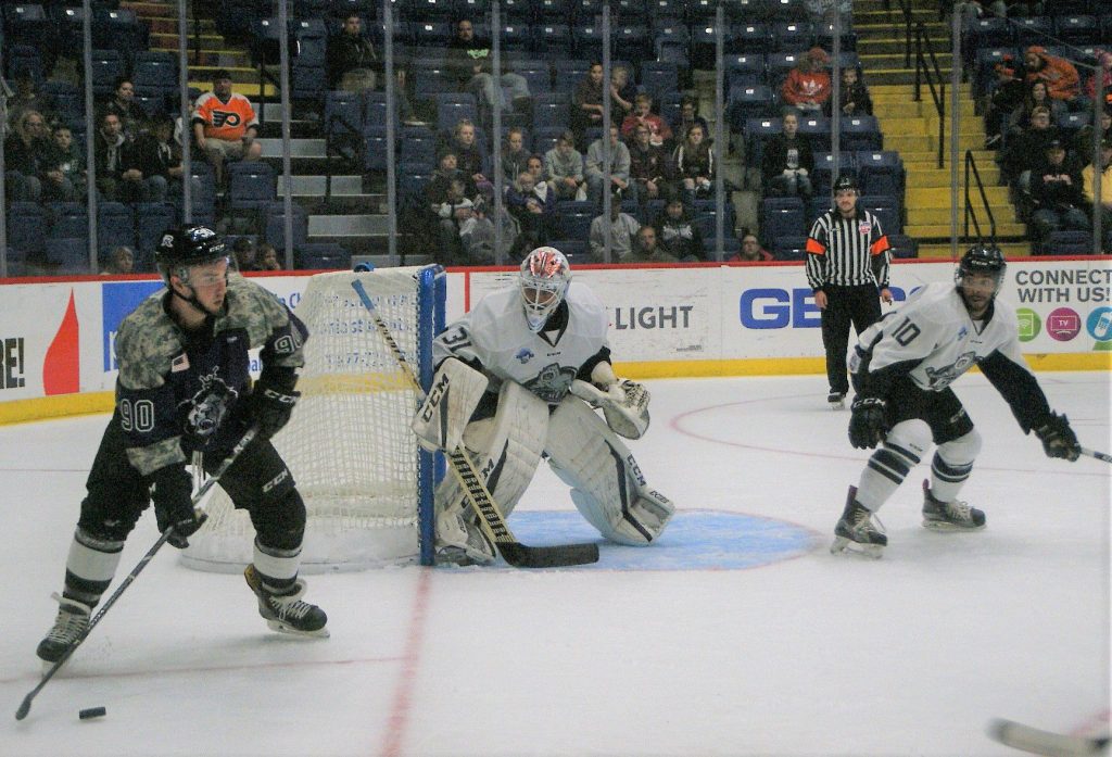 All eyes are on Matt Willows as he waits to pass the puck to a goal rushing Royal