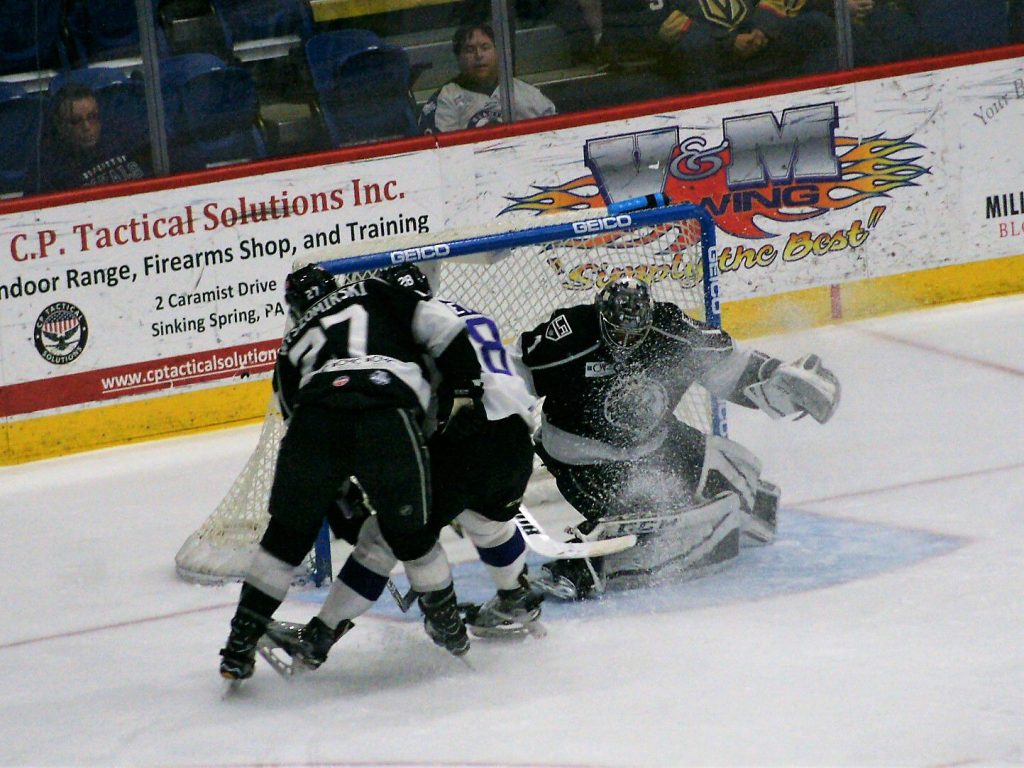 Ice spray in the face of Manchester’s G Charles Williams could not prevent him from making this close save on Reading’s Mark Bennett