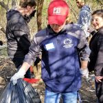 College partners with community, Olivet for trail cleanup 