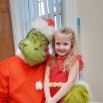 Santa Claus and The Grinch Welcome Children to Share Their Wish Lists