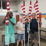 Prospectus Berco Vocation Team Assembles Flags for Fourth of July Celebration